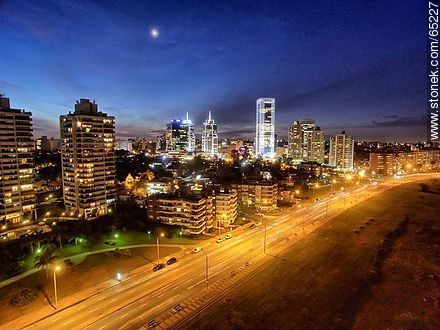 Nocturnal aerial photo of the Rambla Armenia, buildings and towers - Department of Montevideo - URUGUAY. Photo #65227