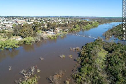 Aerial view of the Santa Lucia River overflowing covering the old Route 11 - Department of Canelones - URUGUAY. Photo #68345