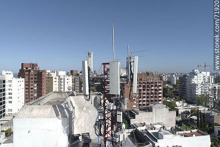 Cell phone antennas on top of a building -  - MORE IMAGES. Photo #71920