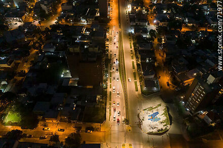 Aerial night view of the Miguel Hernandez plaza over L. A. de Herrera Ave. - Department of Montevideo - URUGUAY. Photo #71977