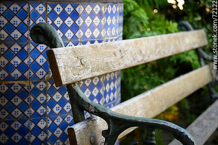 Bench next to a tiled well -  - MORE IMAGES. Photo #72122