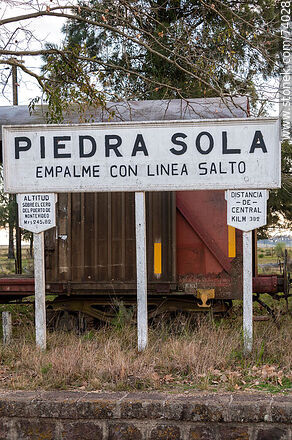 Sign of the train station Piedra Sola Junction with Salto Line with the background of old wagons. - Department of Paysandú - URUGUAY. Photo #74028
