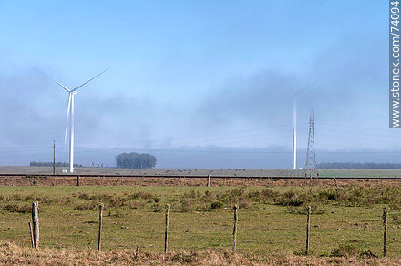 Wind turbines emerging from the morning fog near the Pampa station on Route 5. - Tacuarembo - URUGUAY. Photo #74094