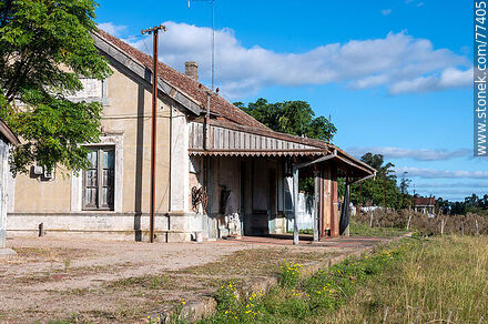 Arroyo Grande train station at Ismael Cortinas on the border of four departments. Platform and tracks covered with grass - Flores - URUGUAY. Photo #77405
