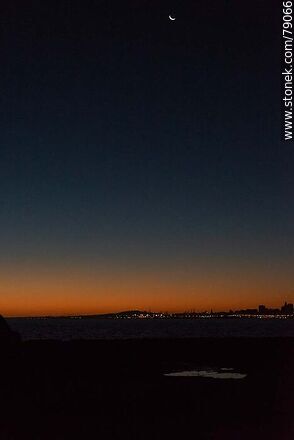New moon far from the horizon at dusk - Department of Montevideo - URUGUAY. Photo #79066