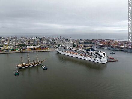 Aerial view of tugboats maneuvering with the training ship Amerigo Vespucci and the cruise ship MSC Poesia - Department of Montevideo - URUGUAY. Photo #84622