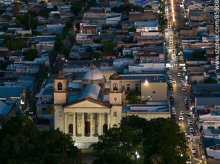 Aerial view of the Basilica Nuestra Señora del Rosario and 18 de Julio street at dusk - Department of Paysandú - URUGUAY. Photo #85908
