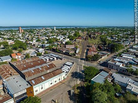 Aerial view of the railroad tracks through the middle of the city - Department of Paysandú - URUGUAY. Photo #85868