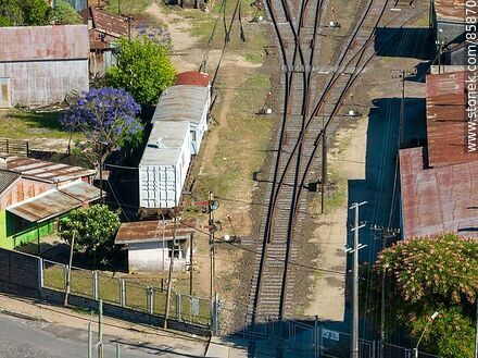 Aerial view of the Paysandú train station and its railroad tracks through the city - Department of Paysandú - URUGUAY. Photo #85870