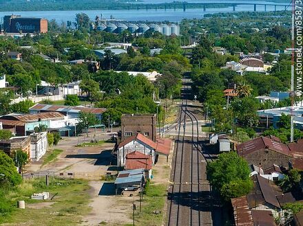 Aerial view of the Paysandú train station and its railroad tracks through the city - Department of Paysandú - URUGUAY. Photo #85873