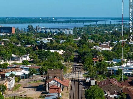 Aerial view of the Paysandu train station and its railroad tracks through the city. General Artigas Bridge - Department of Paysandú - URUGUAY. Photo #85874