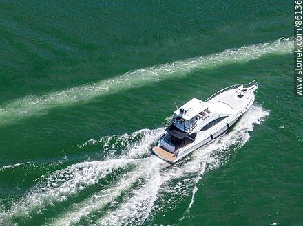 Aerial view of a boat at sea - Punta del Este and its near resorts - URUGUAY. Photo #86136